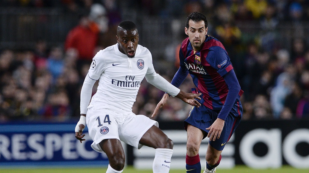 Sergio Busquets con Blaise Matuidi